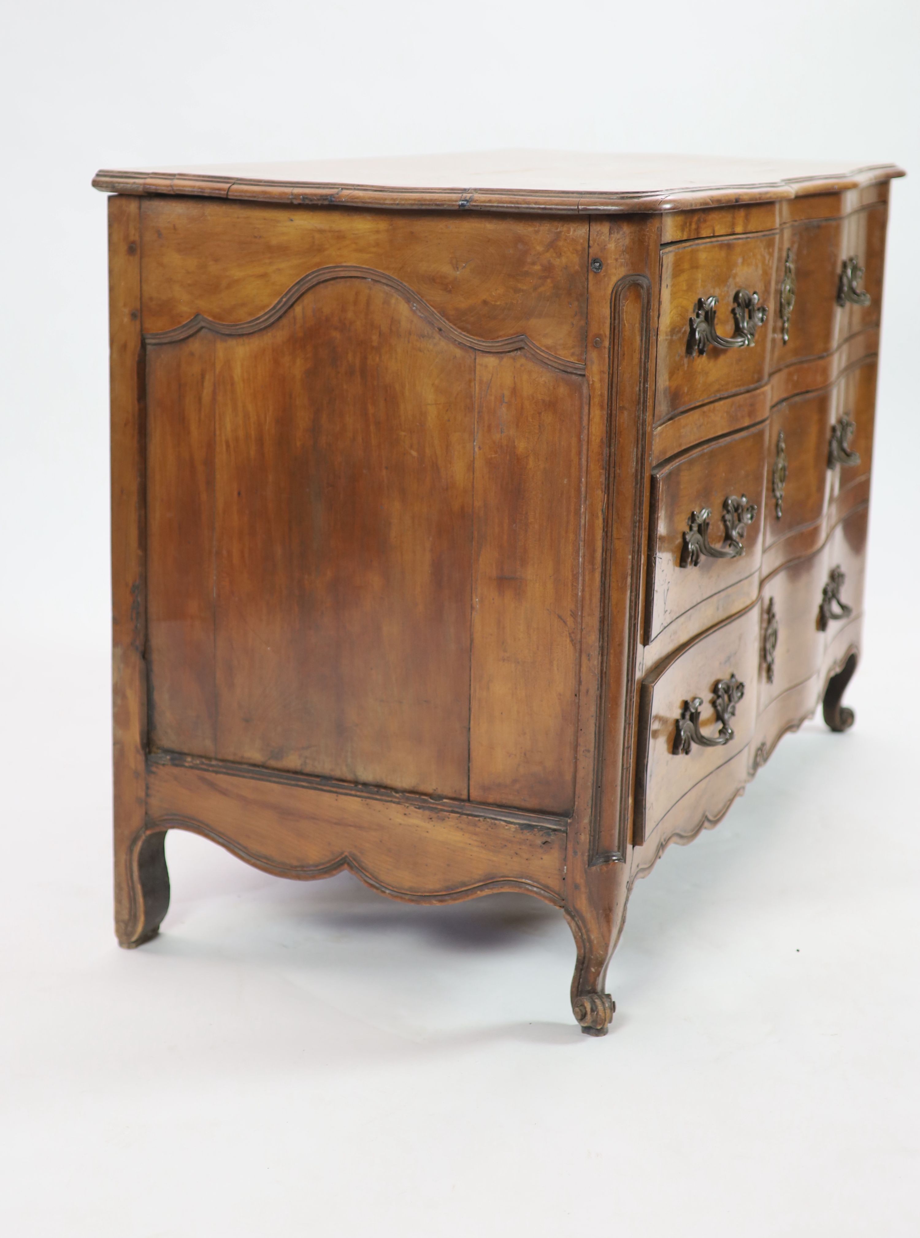A Louis XV chestnut serpentine chest of three drawers, dated 1776, W.122cm D.63cm H.86cm